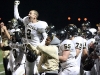 Senior Cooper Page and senior Mizani Hobson celebrate after another Tiger  touchdown. The Tigers were victorious in their regional match against Bishop Miege High School on November 5.