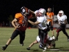 Senior Danny Manning is facemasked by an SM North defensive player on Oct. 24 at SM North Stadium. The defense was called for the facemask and recived a 15 yard penalty.