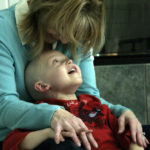 [Best Overall] Deliece relaxes with her son Braden after playing with blocks. Braden is at home until Dec. 27, until they fly back to Philadelphia to assess the MIBG's impact on the neuroblastoma. (Meagan Kabel, Blue Valley High School, 6A, Stilwell, KS)