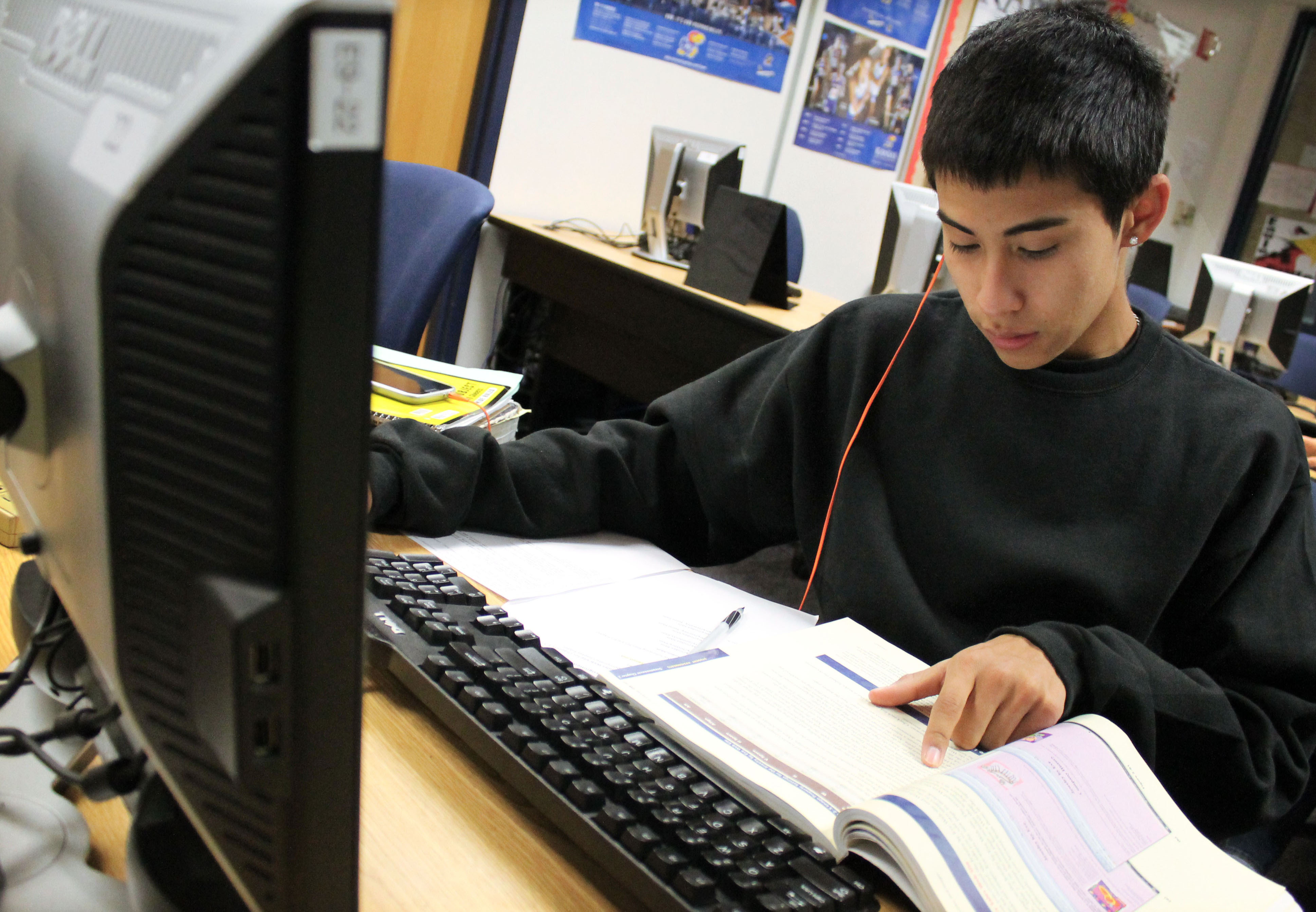 1st Place—Academics, Jennifer Terrell, Maize. "Sophomore Jon Nguyen works on desktop publishing assignments."