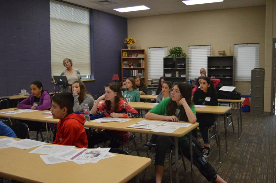 Students listen to retired adviser Mary Patrick at the Middle School KSPA workshop at Derby North Middle School April 1, 2017. 