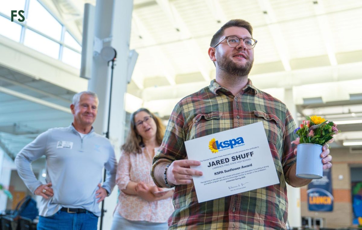 Free State adviser Jared Shuff thanks his students at a surprise ceremony after receiving the 2025 KSPA Sunflower Award